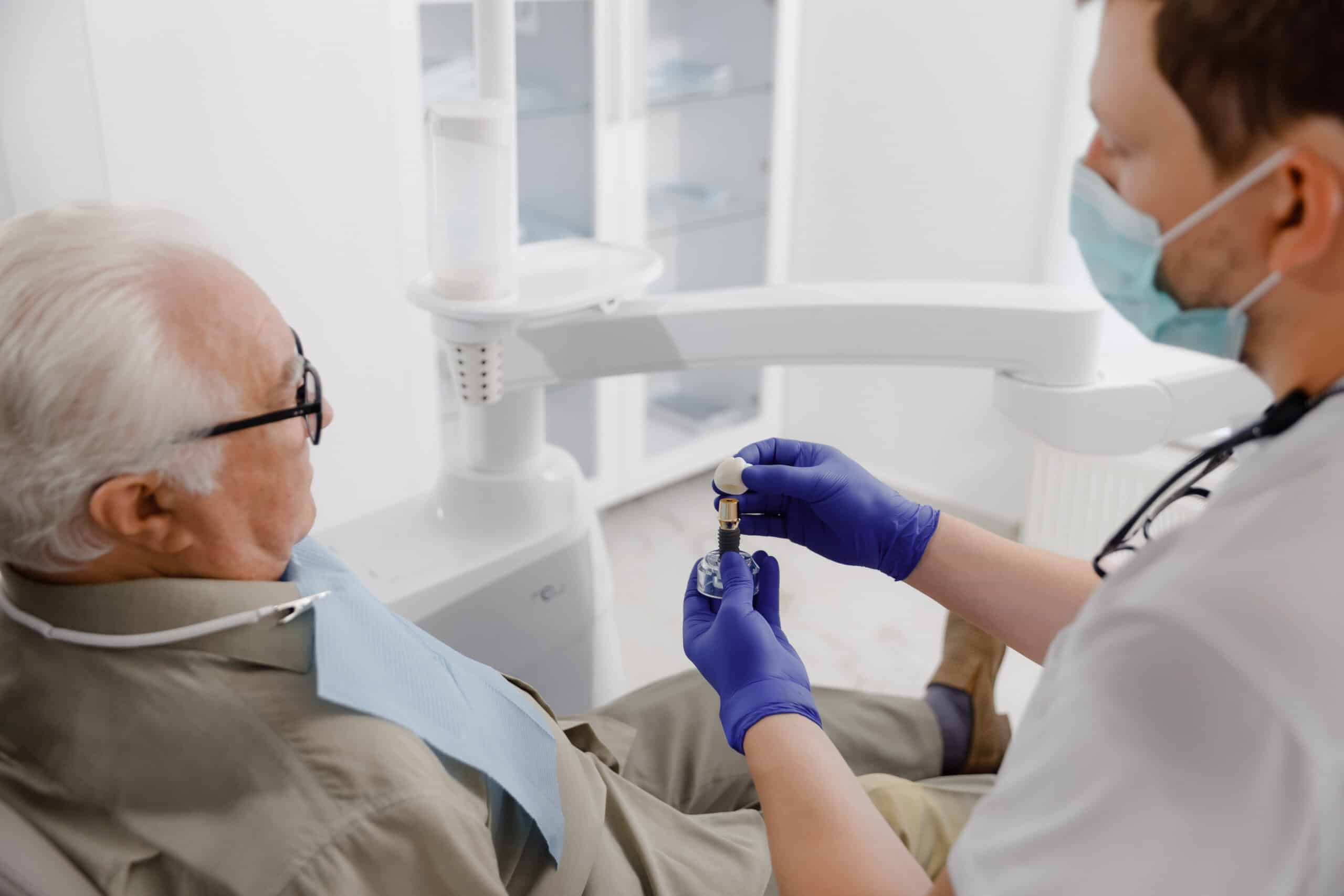 Old man patient have a check appointment at dental clinic the dentist doctor examining the teeth doctor using dental instruments he checking problems with filing